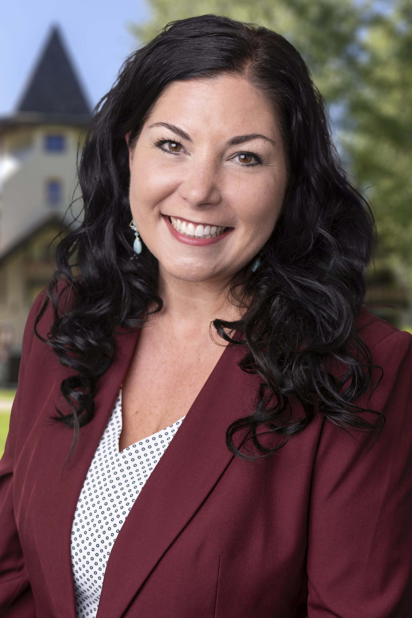 General Manager Ginger headshot in front of Olympic Village Inn